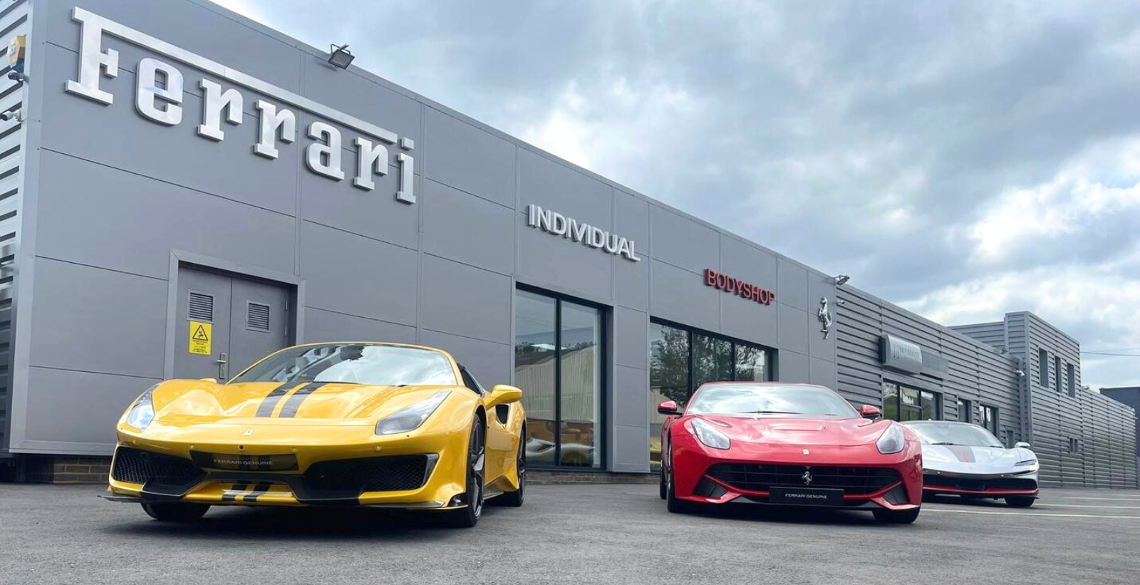 Cars displayed outside the bodyshop